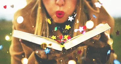 A reader blowing confetti from an open book